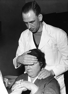 Dr. King gives spiritual healing to a patient